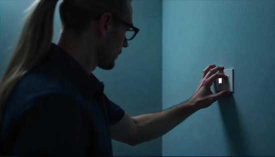 Private investigator analyzing surveillance graphs on computer monitor